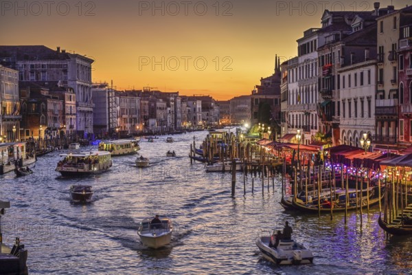 Evening view of the Grand Canal, on the right the Riva del Vin, jetty, gondolas, boats, Venice, Veneto, Italy, Europe