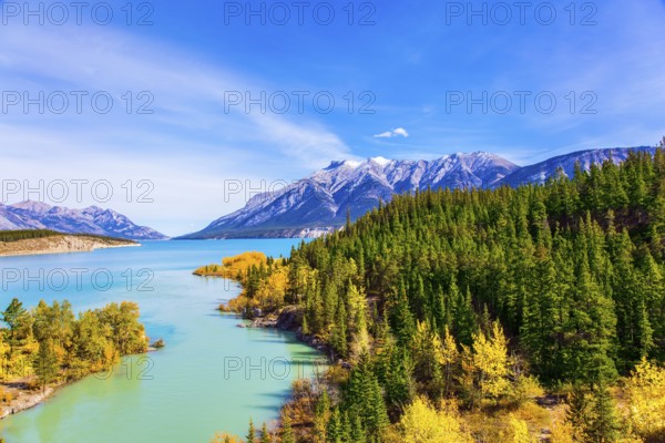 The picturesque Abraham lake in the mountain valley of the Rockies of Canada. Concept of active, ecological and photo tourism