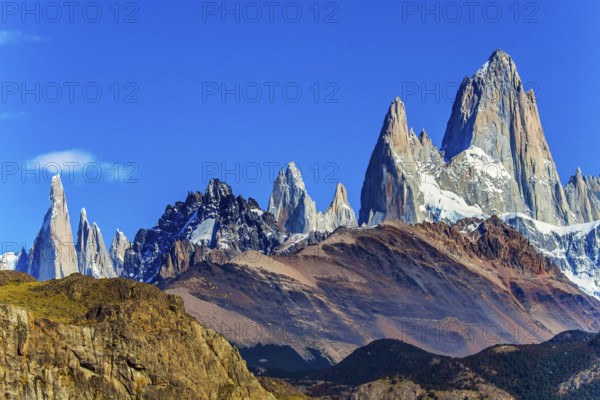 Fitzroi or Chaltel - mountain peak in Patagonia between Argentina and Chile. Magnificent mountain range, illuminated by the midday sun. The concept of extreme, active and photo tourism