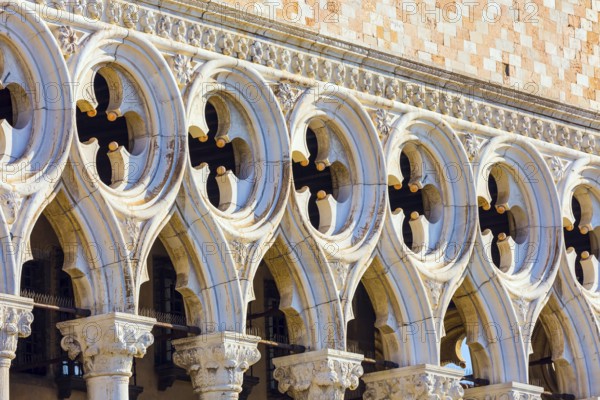 Doge's Palace is monument of Italian Gothic architecture. Decor element. Magical journey to magnificent Venice. Doge's Palace in Piazza San Marco. The concept of cultural and photo tourism