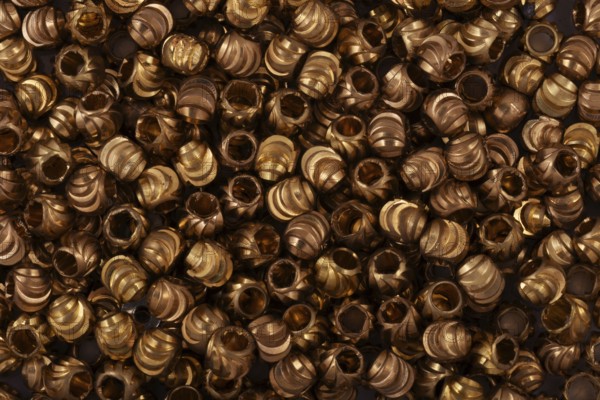 Golden beads close-up on a background