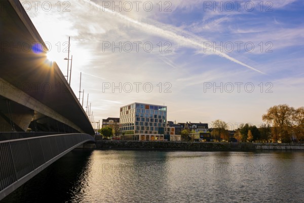 Modern Building and a Bridge over River Aare with Sunbeam in a Sunny Autumn Day in Solothurn, Canton Solothurn, Switzerland, Europe