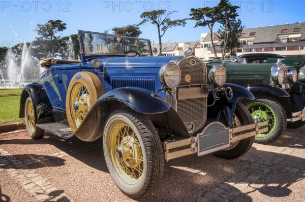 Lisbon, Portugal - Sep 29, 2024: View of classic Ford Model A or A-Model Ford or the A and A-bone in original blue color with soft top down parked on cobblestone road during annual Classic Car Owners meeting on sunny day. Ford Motors, USA, North America