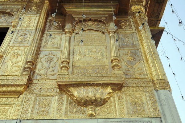 Embossed on golden temple, amritsar, punjab, india, asia
