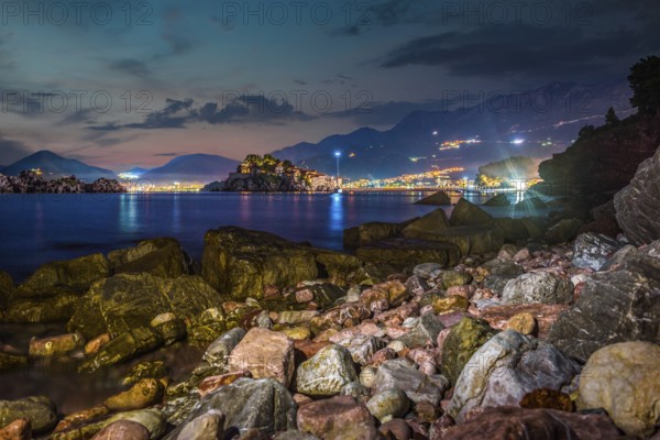Night over stony sea shore in Sveti Stefan, Montenegro, Europe
