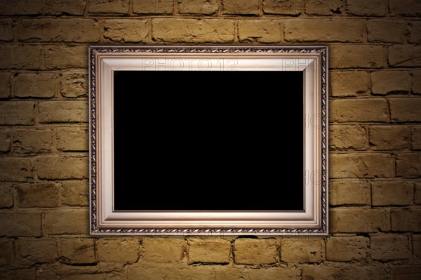 Vintage brown textured brick wall with a frame