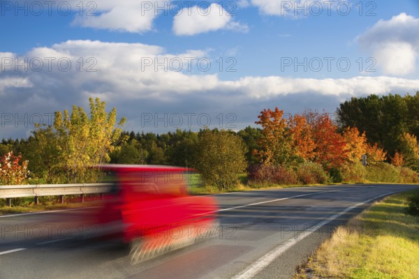 Speed car on a road in Krkonose mountain, Czech Republic, Europe