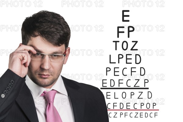 Man with glasses on eyesight test isolated on white background