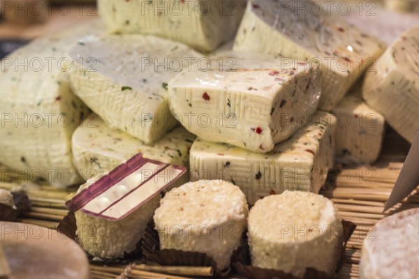 Pieces of delicious white goat cheese with spices