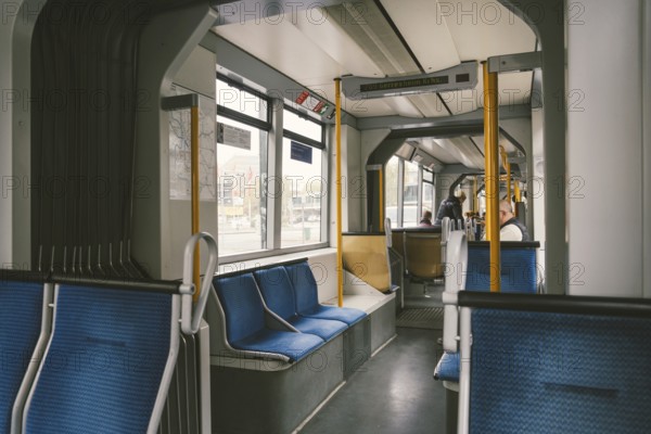 High-speed tram on the city street. Modern Tram In Dusseldorf, Germany October 20, 2018. Tram inside view, passenger compartment with passengers during a ride in Germany