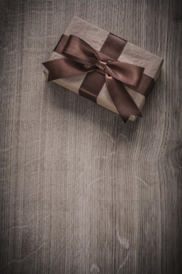 Boxed vintage present container on wooden board holiday concept copyspace