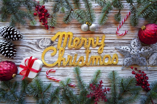 Merry Christmas spell word on white wood background