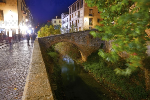 Darro carrera street river and arch in Granada of Spain at Andalusia