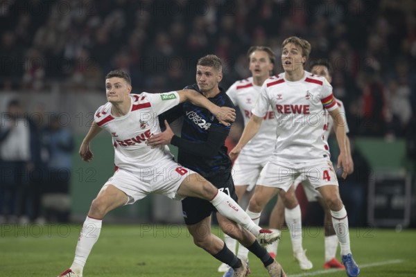 BEAUTIFUL SPORTS/ (DFL/DFB REGULATIONS PROHIBIT ANY USE OF PHOTOGRAPHS AS IMAGE SEQUENCES AND/OR QUASI-VIDEO) Cologne, RheinEnergieStadion, North Rhine-Westphalia, Eric Martel (1.FC Köln, midfield, #6), Marton Dardai (Hertha BSC, defence, #31), Timo Hübers (1.FC Köln, defence, #4), DFB-Pokal 1.FC Köln, Hertha BSC on 04.12.2024 at RheinEnergieStadion in Cologne Germany