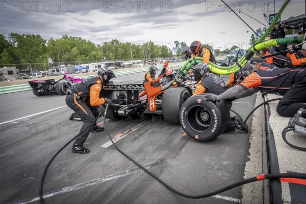 SANTINO FERRUCCI (14) of Woodbury, Connecticut comes down pit road for service during the XPEL Grand Prix at Road America in Elkhart Lake, WI