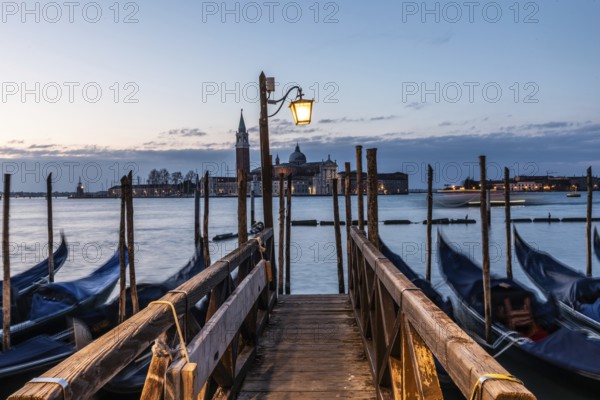 Morning atmosphere, Venetian gondolas with the church of San Giorgio Maggiore in the background, Venice, UNESCO World Heritage Site, Veneto, Italy, Europe