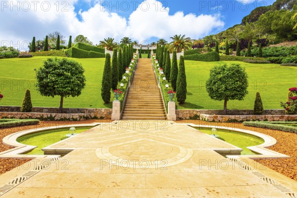 Bahai World Center. Pilgrimage center and popular tourist destination. Clear sunny day by the sea. Marble staircase and rows of cypress trees on Mount Carmel. Haifa, Israel, Asia