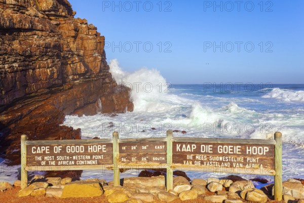 South Africa. Powerful ocean surf. Cape of Good Hope at the southern tip of the Cape Peninsula. White foam of the ocean surf. Bright sunny summer February day