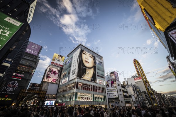 OSAKA, JAPAN - SEPTEMBER 26 2024: The view down Dotonbori River from Ebisubashi Bridge on a clear autumn day in Osaka, Japan, Asia