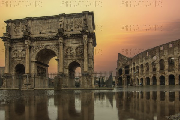 Rainy weather in the morning, sunrise in an old historic city. Beautiful details and historic Roman buildings of the Eternal City, Arco di Costantino, Rome, Italy, Europe