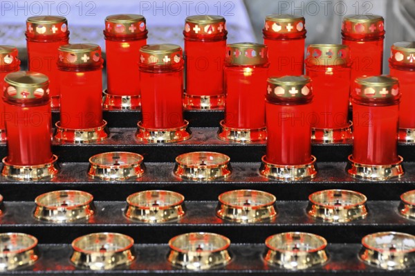 Red prayer candles lit for sacred devotion, Assisi, Umbria, Italy, Europe