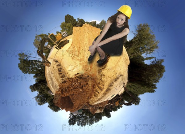A Female Construction Worker on a job site wearing a hard hat