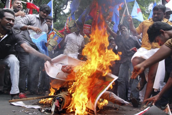 Supporters of several Tamil nationalist parties burn effigies stage protest against the Kaveri water sharing issue Chennai