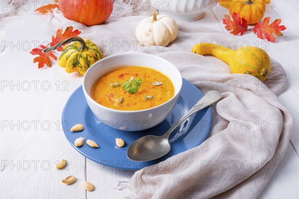Healthy pumpkin soup with ginger carrots and coconut milk