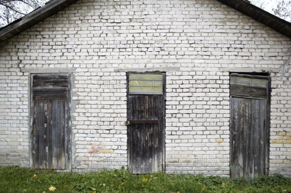 Three doors in the old grey brick garage