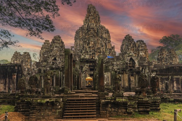The famous Bayon temple with the ancient stone faces