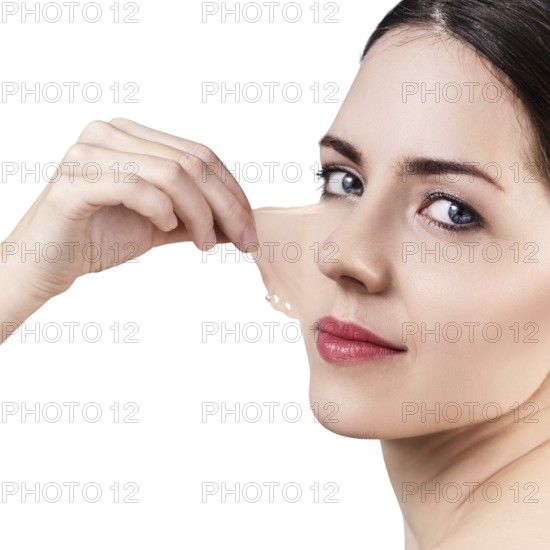 Beautiful woman remove her old dry skin from face. Over gray background