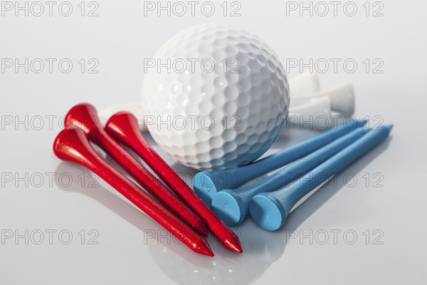 Different golf equipments on the glass table