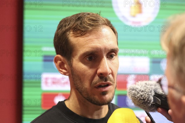 Head coach / coach Julian Schuster (SC Freiburg) at the press conference, PK after the match for the DFB Cup 2024-25, 2nd round: SC Freiburg vs Hamburger SV, Freiburg im Breisgau, Germany / Germany