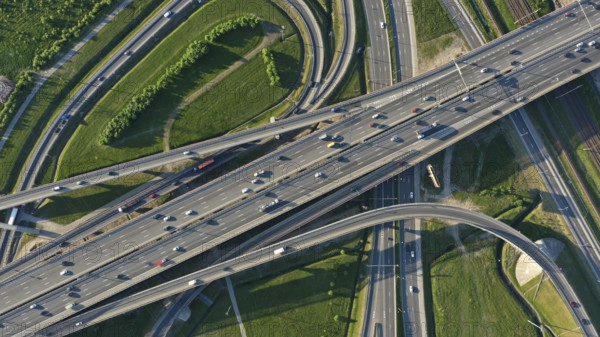 Aerial top view of lot of cars on modern road junction