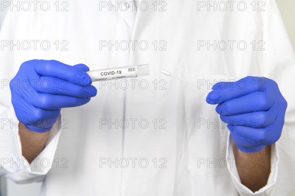 Doctor with covid-19 test set
