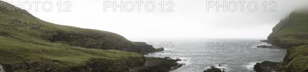 Typical landscape on the Faroe Islands, with green grass and rocks on Suduroy, Suduroy, Faroe Islands, Denmark, Europe