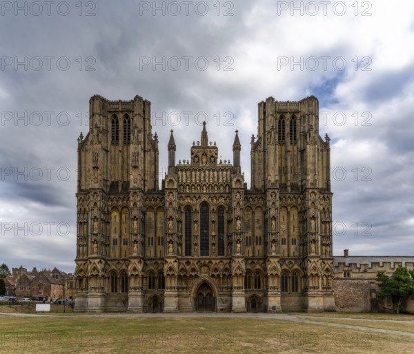 Wells, United Kingdom, 1 September, 2022: view of the two spires and front of the 12th-centruy Gothic Wells Cathedral in Somerset, Europe