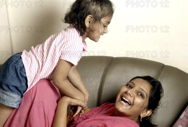 Mother Playing with baby Mumbai Maharashtra India Asia MR#736L 736K