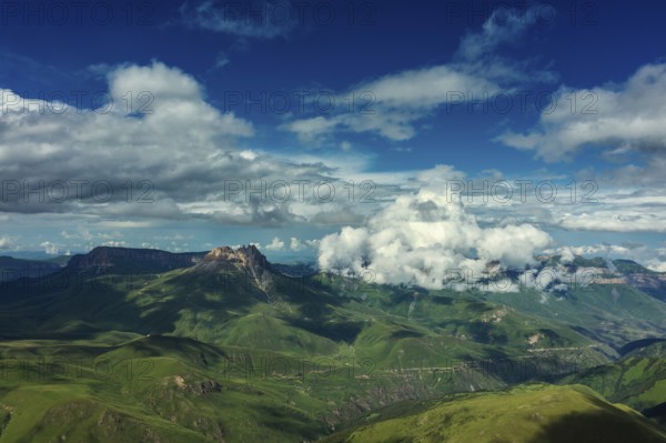 Aerial view on hills and mountains under clouds in Kabardino-Balkaria, Caucasus, Russia, Europe
