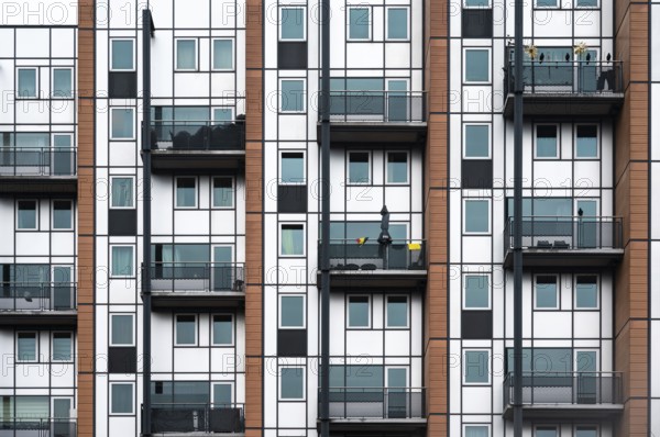 Leuven, Flemish Brabant Region, Belgium, April 1, 2023, Facade with windows and balconies of a social housing apartment block, Europe