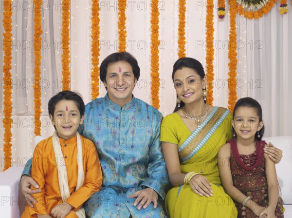 Parent with children in traditional wearing MR#779P, MR#779Q, MR#779R, MR#779S