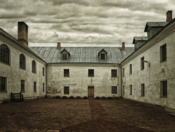 The courtyard of the monastery under a dark sky
