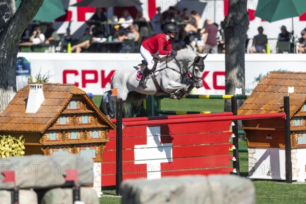 Geraldine Straumann of Switzerland, riding Long John Silver 3 compete in the BMO Nations Cup during the CSIO Spruce Meadows, Masters, in Calgary, Alberta, Canada, North America