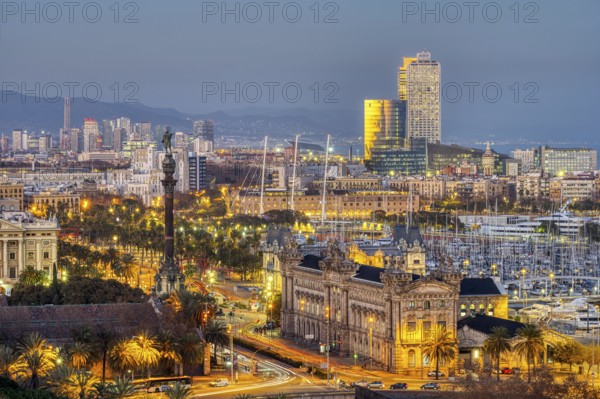 The Barcelona skyline with the Columbus statue at dusk