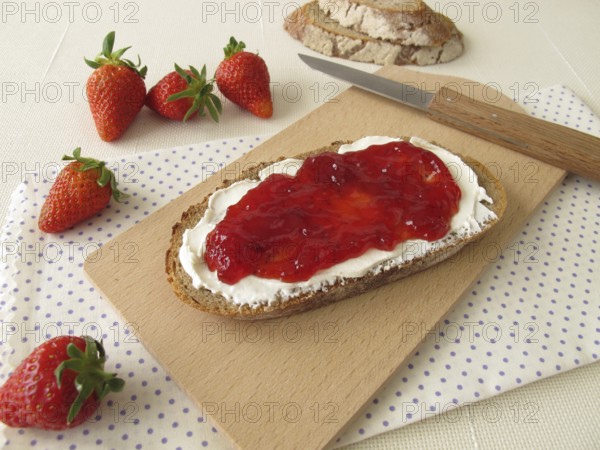 Bread with cream cheese and strawberry jam