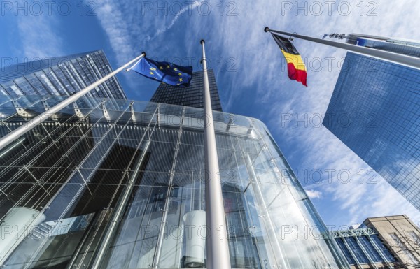 Brussels, Belgium, 03 10 2019: the contemporary North Galaxy tower with the Federal government offices and a Belgian and European flag in the business Little Manhattan district, Europe