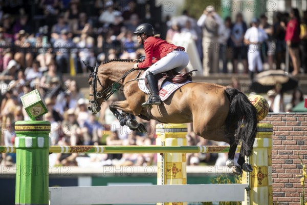 Jorne Sprehe of Germany and riding Sprehe Hot Easy compete in the first round of the 1.60m CPKC International during the Spruce Meadows Masters, presented by Rolex, in Calgary, Alberta, Canada, North America