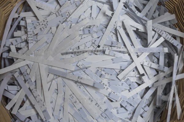 Shredder has destroyed top secret data - close-up of paper shredder