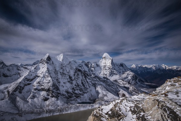 Ama Dablam and other Mountains and Dramatic Sky. Nepal, Himalaya