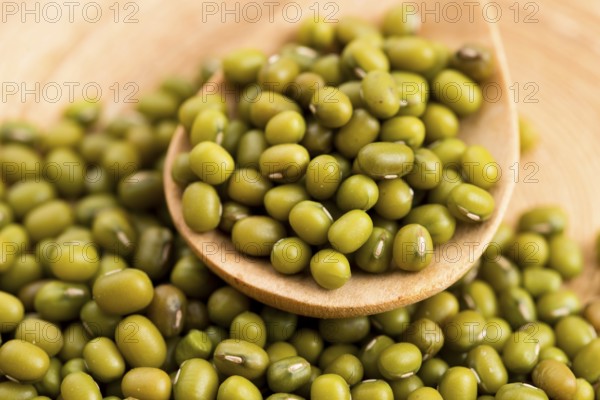 Mung beans over wooden spoon, lodz, poland